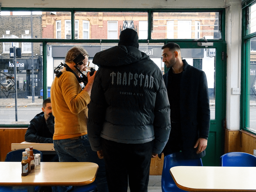 Actors filming a take.