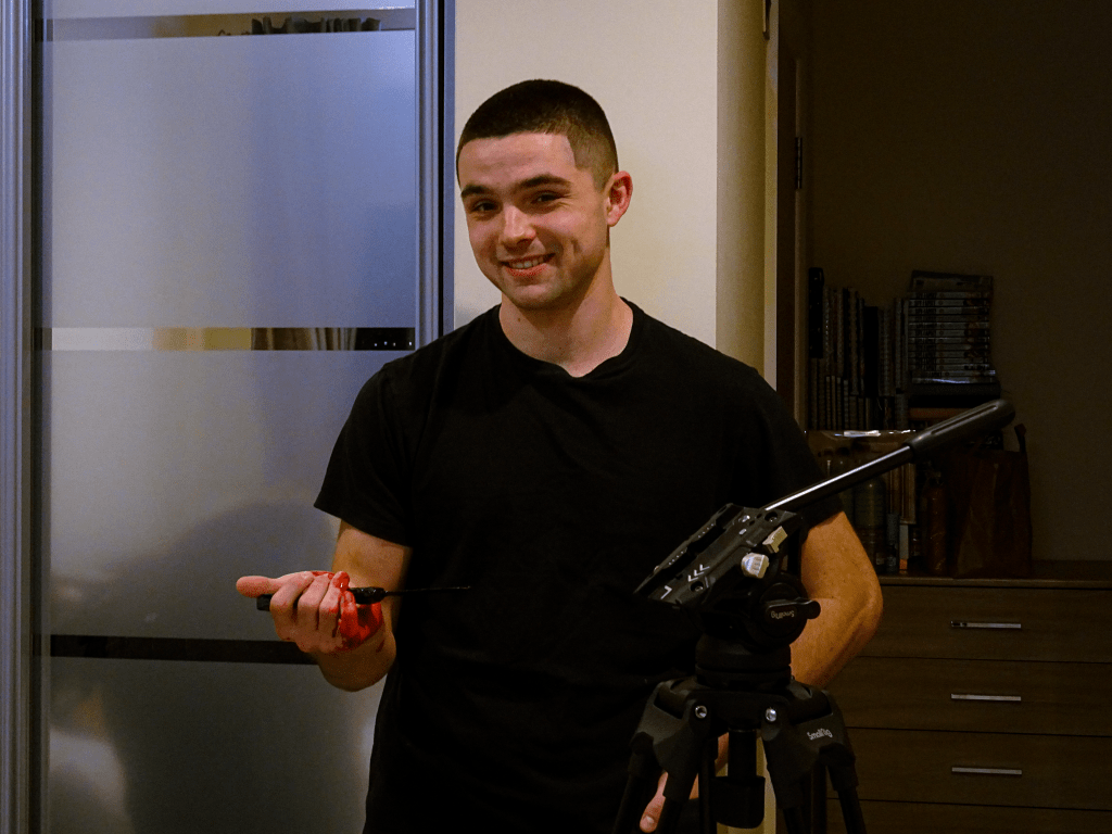 Actor posing smiling.