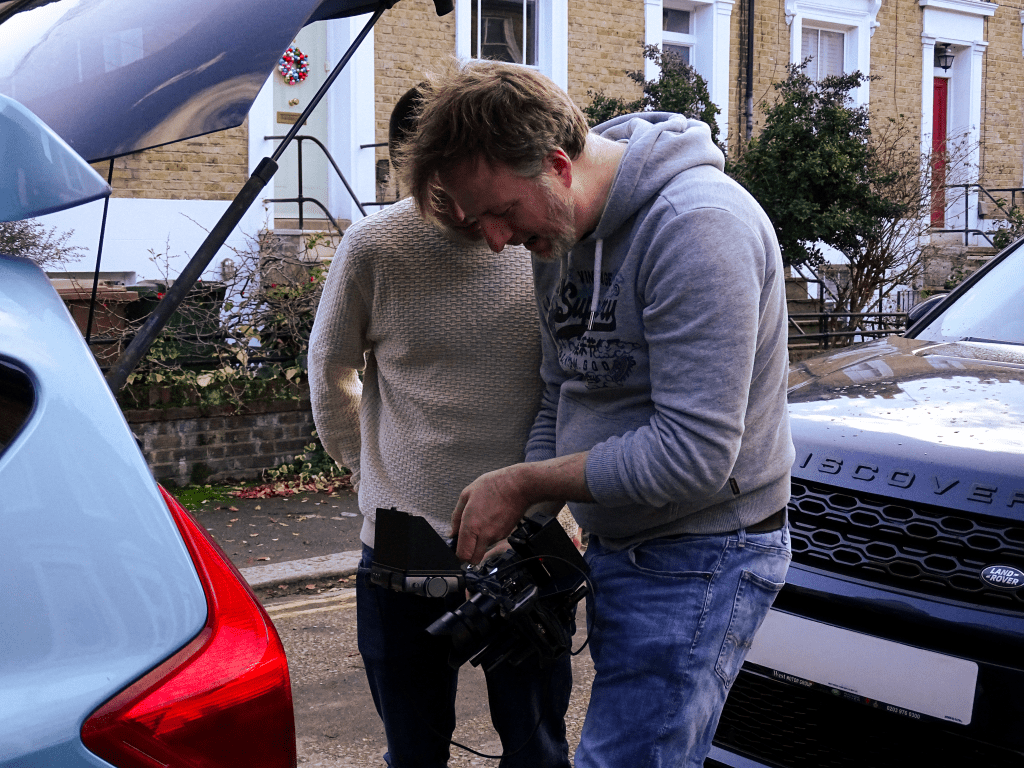 Actor and director checking a take.