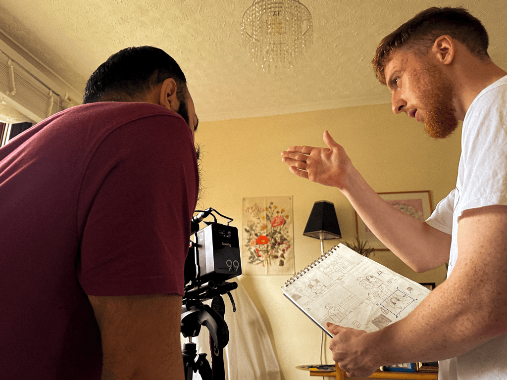 Director explains a shot to DOP using the storyboard.